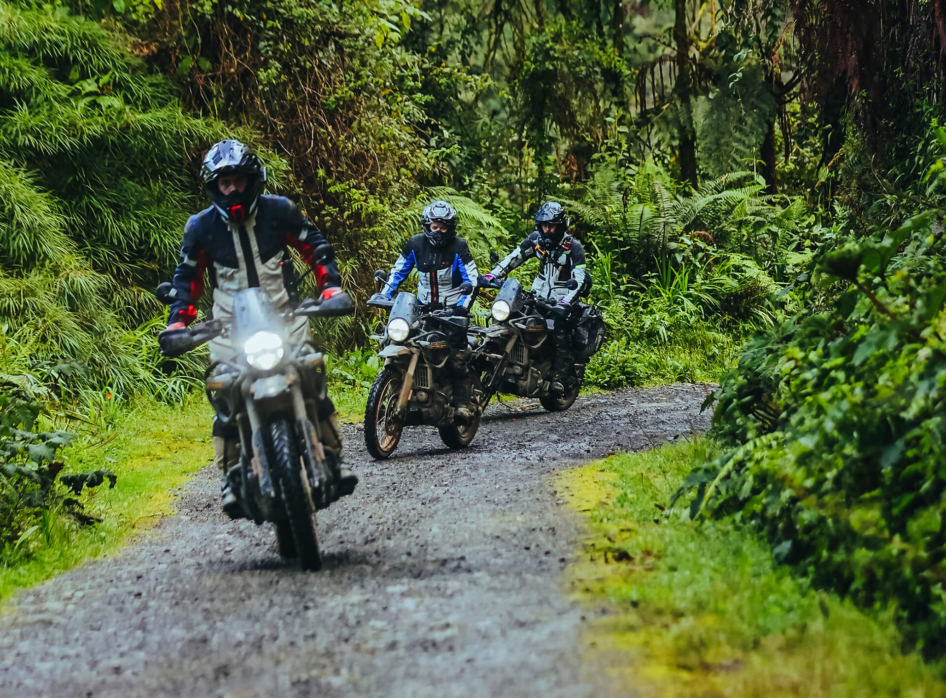 Group of motorcycle riders in RE Himalayans 450 driving through an off-road route in Colombia during a tour with Fire of The South